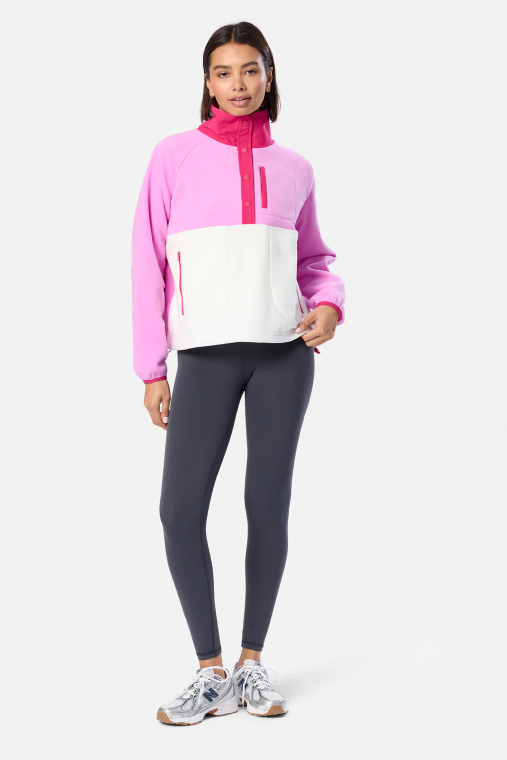 Model wearing Gym+Coffee Snap Polar Fleece Neon Pink with contrasting pockets styled with leggings Shop Gym+Coffee at Dotique