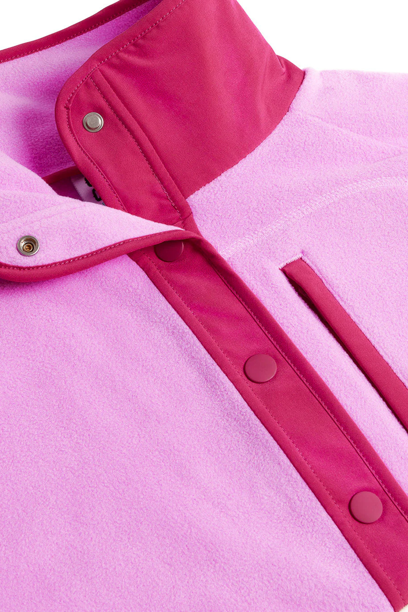 Close-up of Gym+Coffee Snap Polar Fleece Neon Pink with snap buttons and contrast trim by Gym+Coffee Shop Gym+Coffee at Dotique