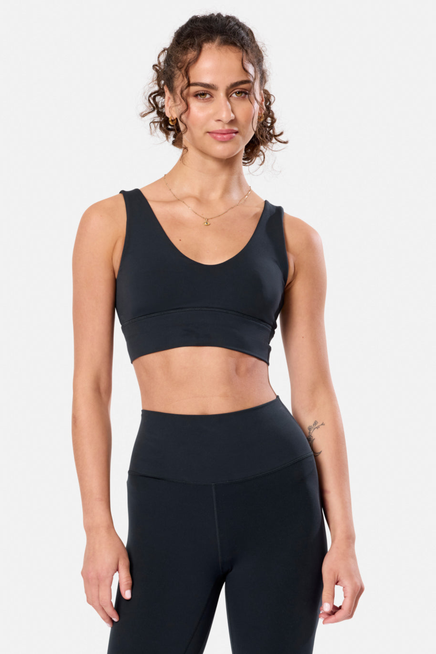 Model wearing Gym + Coffee Soft-Motion Bra Black by Gym+Coffee, shop the Gym+Coffee collection at Dotique online.