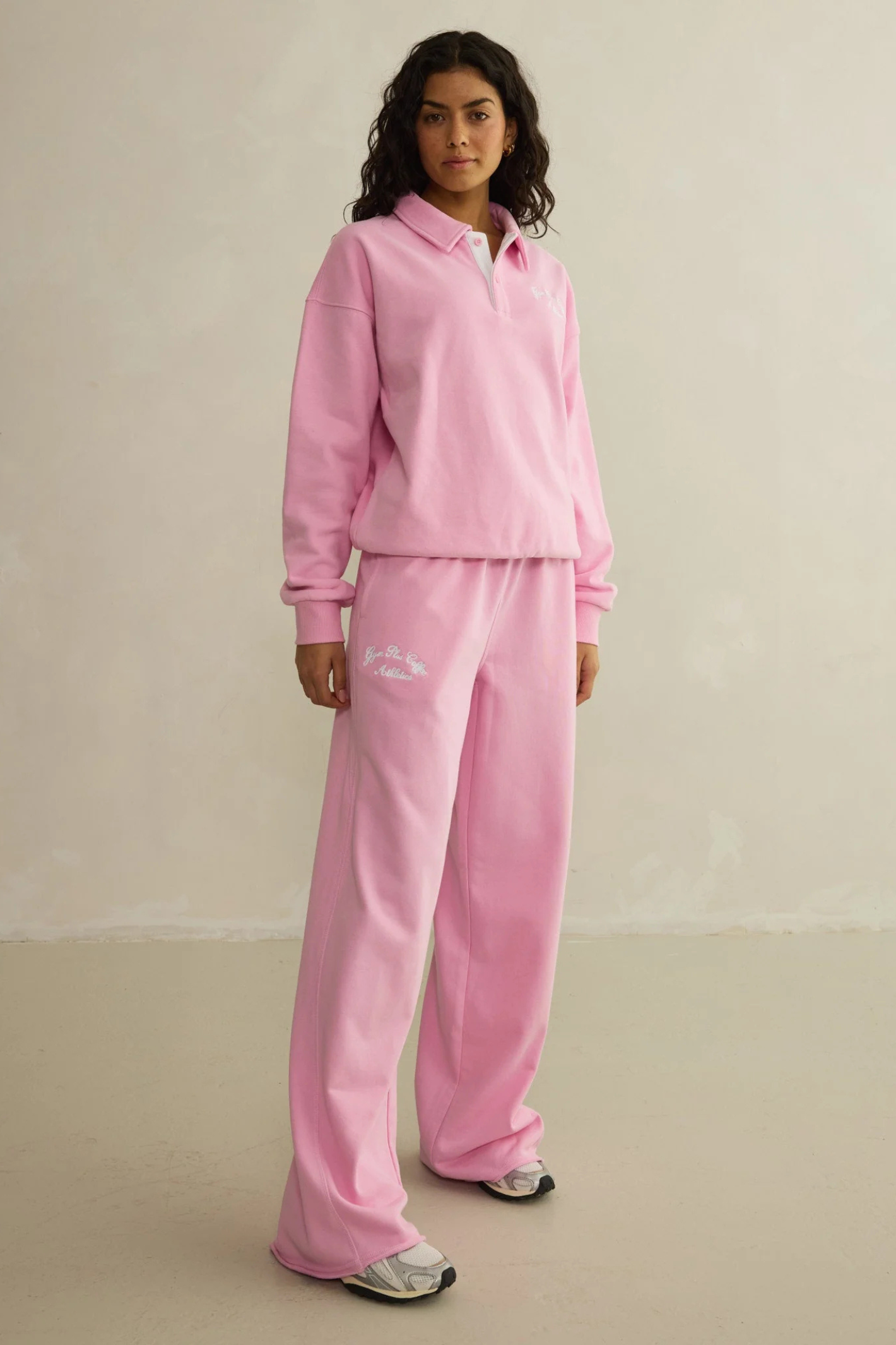 Model wearing Gym+Coffee Urban Wide Leg Jogger in Pink Blossom by gym+coffee, shop gym+coffee at Dotique