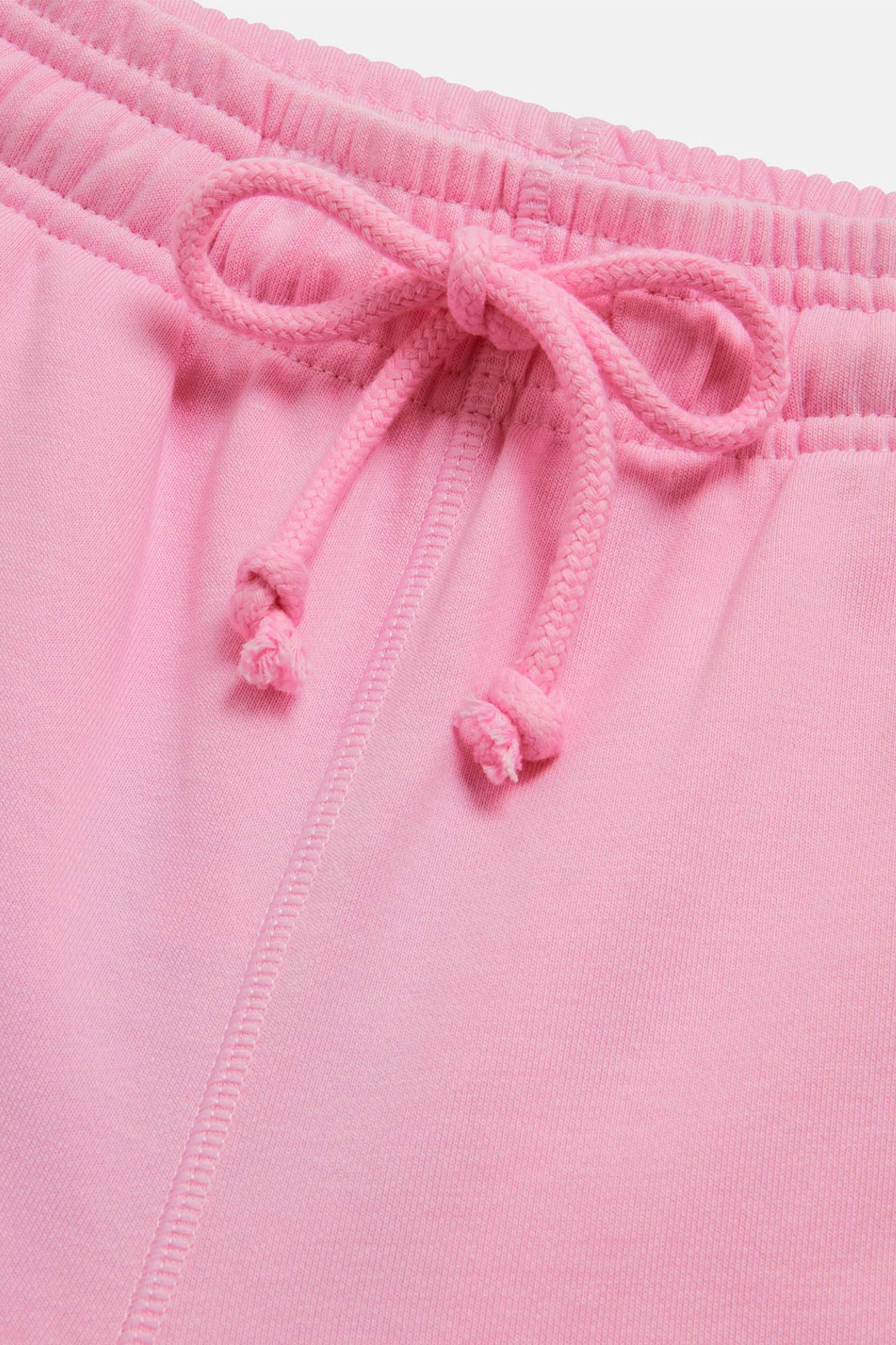 Close-up of drawstring and stitching detail on Gym+Coffee Urban Wide Leg Jogger in Pink Blossom by gym+coffee shop at Dotique