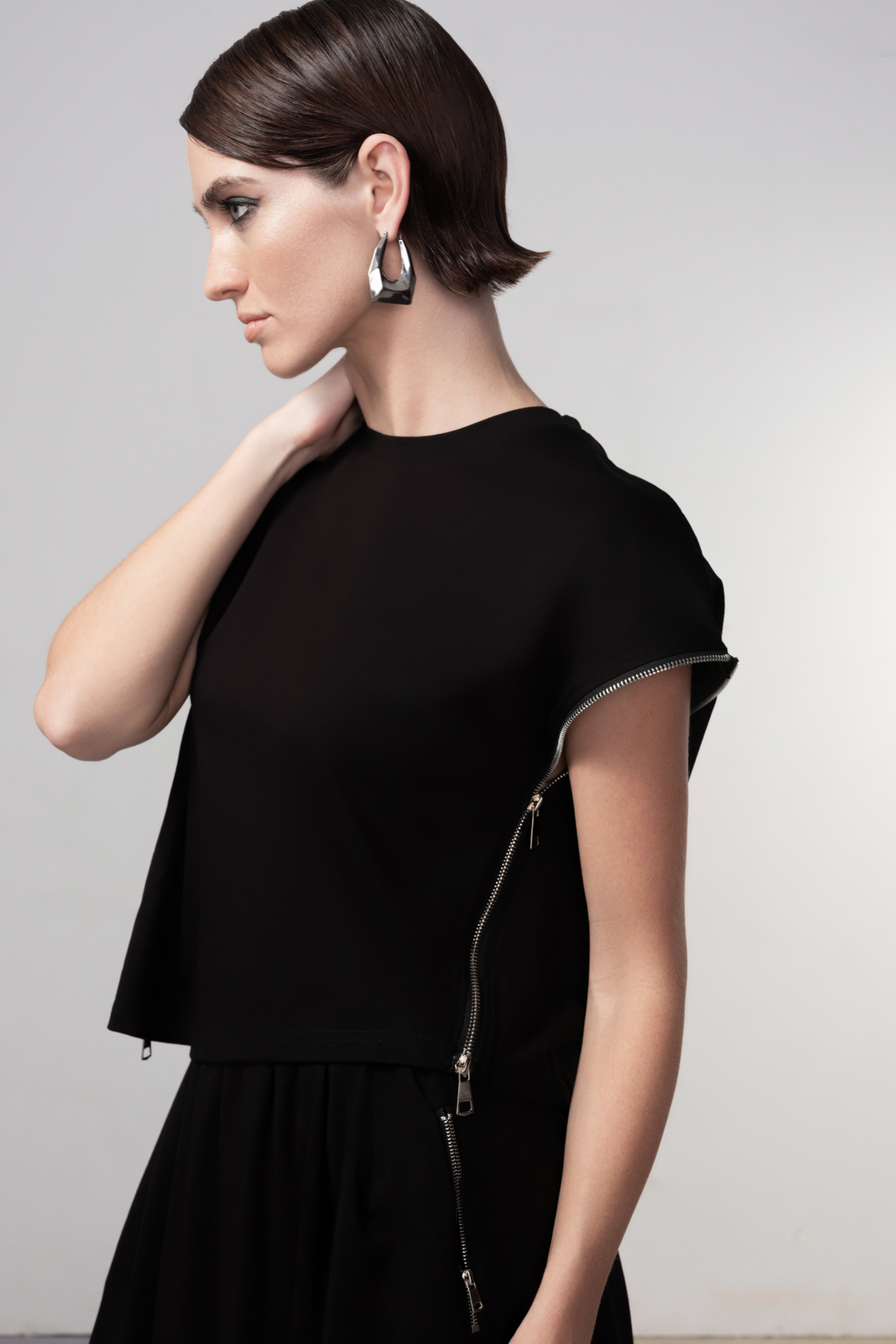 Haako black sleeveless top with side zip detail styled in a minimalist look at Dotique
