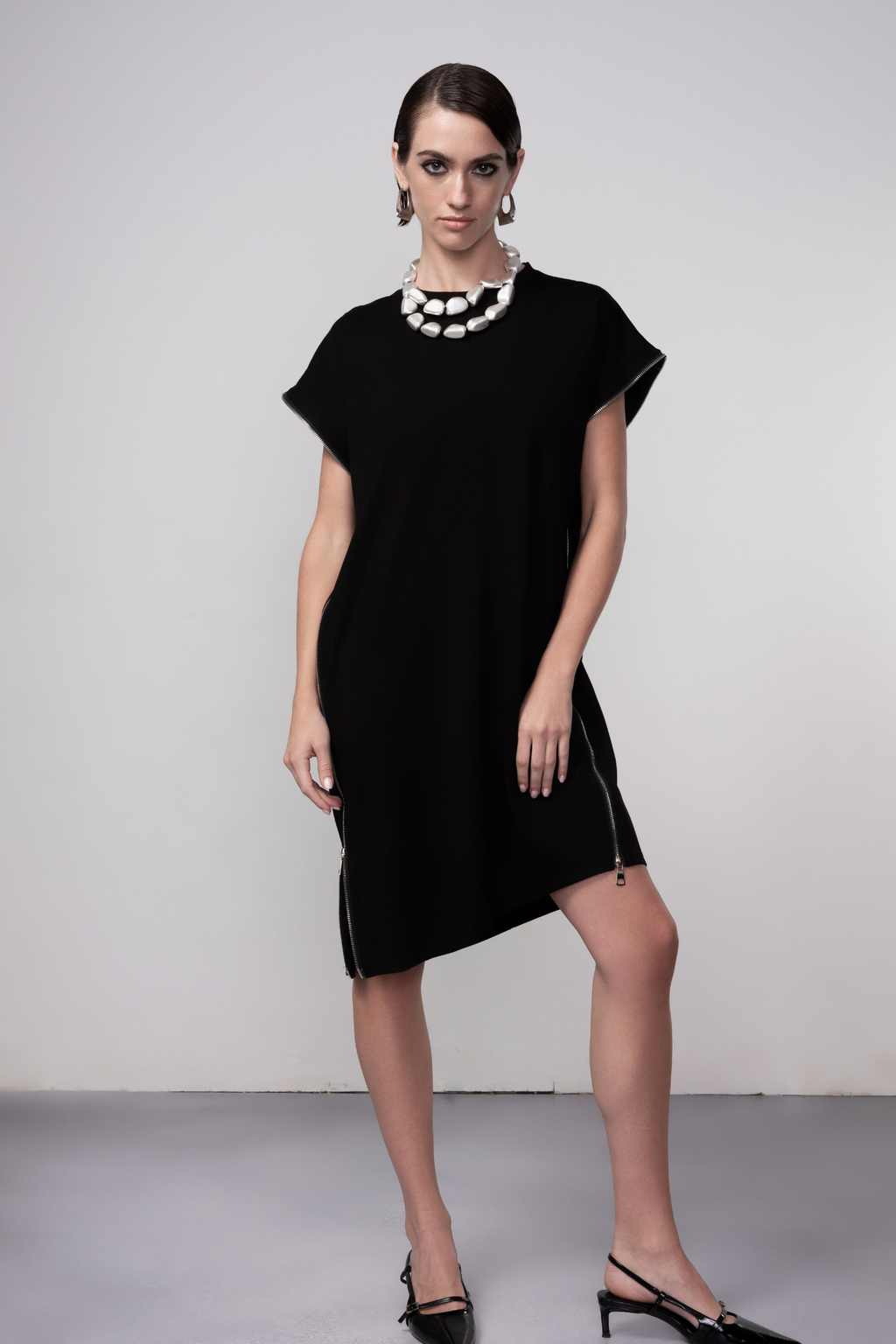 Haako black zip detail shift dress styled in a contemporary minimalist look at Dotique