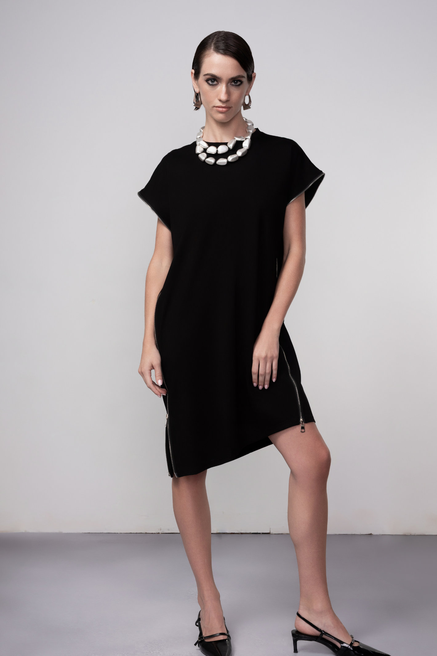 Haako black zip detail shift dress styled in a contemporary minimalist look at Dotique