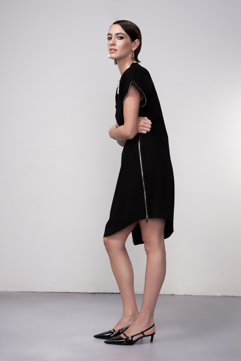 Haako black zip detail shift dress styled in a contemporary minimalist look at Dotique