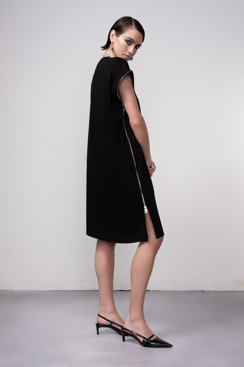 Haako black zip detail shift dress styled in a contemporary minimalist look at Dotique