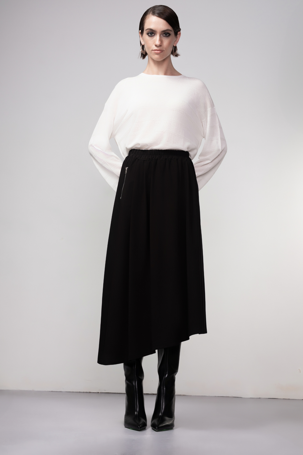 Haako black asymmetric midi skirt with a clean modern silhouette at Dotique