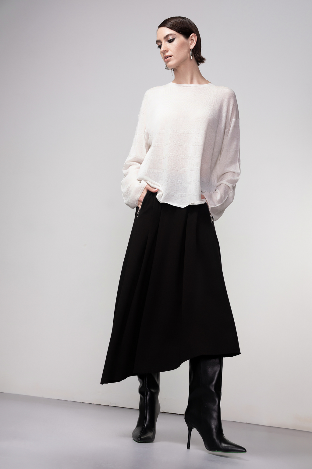 Haako black asymmetric midi skirt with a clean modern silhouette at Dotique