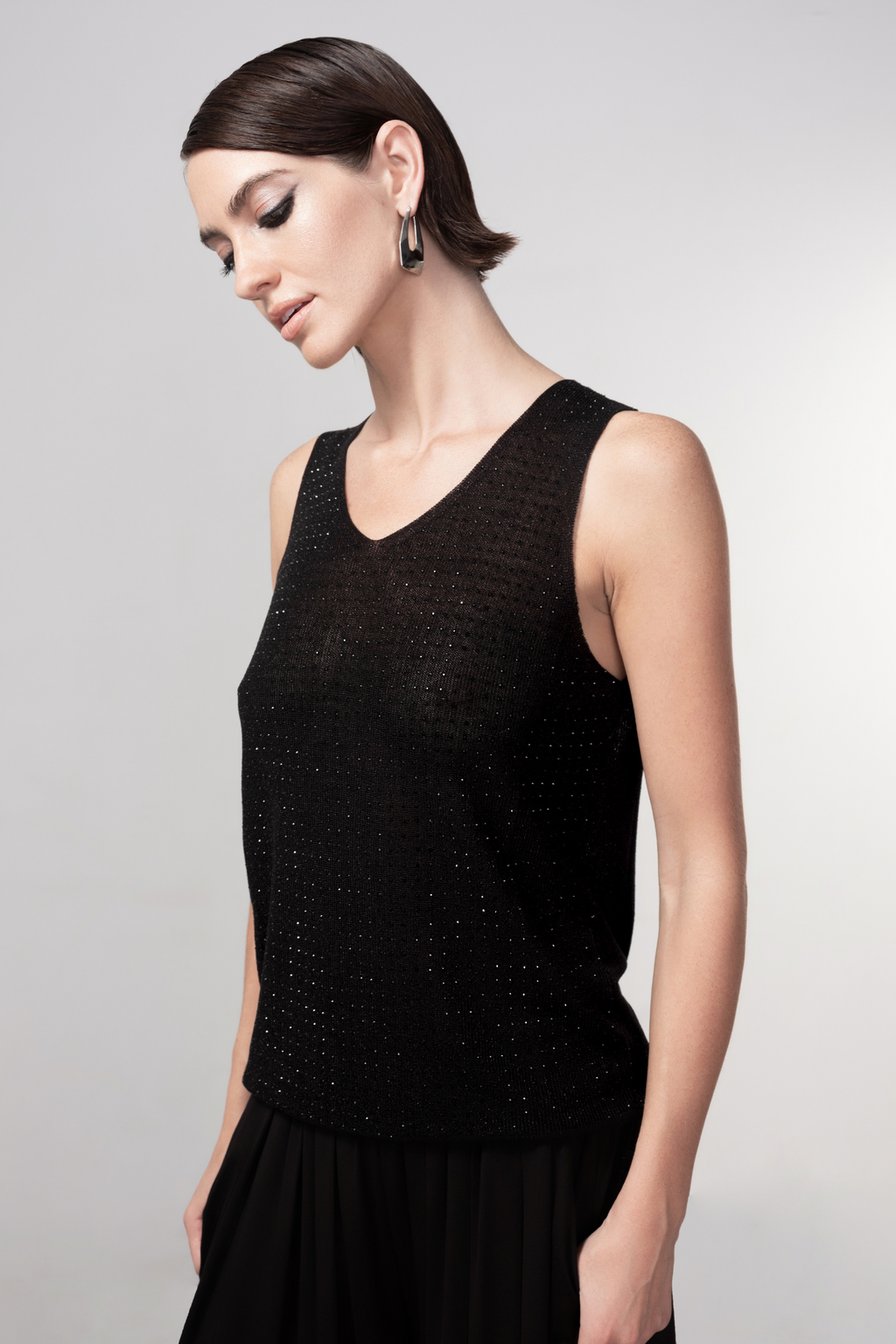 Haako black sparkle knit vest styled in a modern minimalist outfit at Dotique