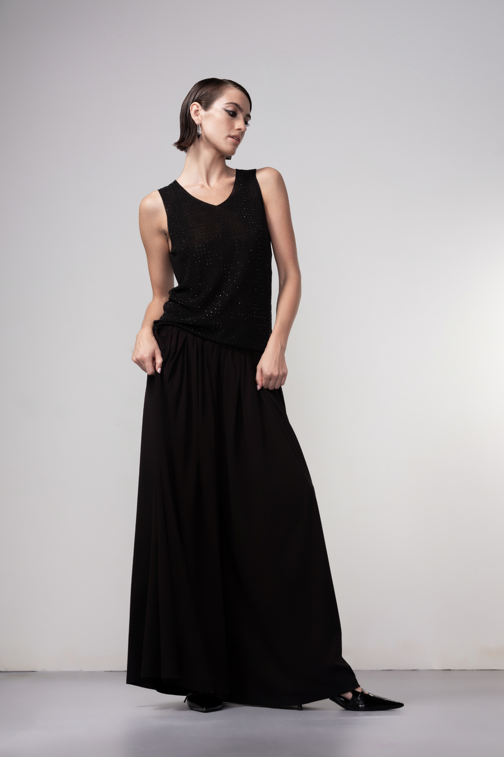 Haako black sparkle knit vest styled in a modern minimalist outfit at Dotique