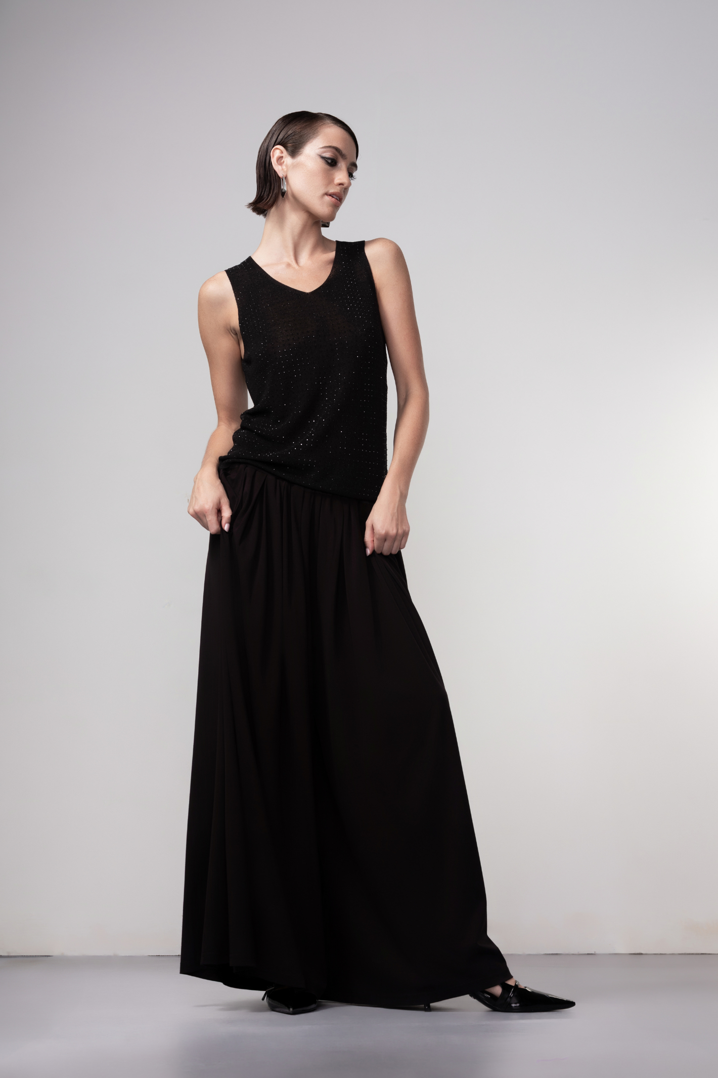 Haako black sparkle knit vest styled in a modern minimalist outfit at Dotique