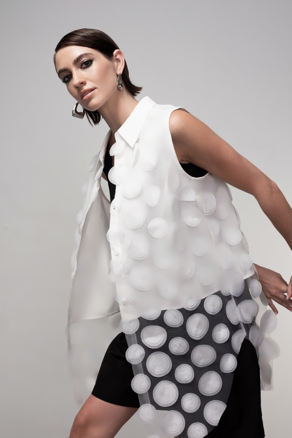Haako white sheer long vest with circle detail styled in a minimalist layered look at Dotique
