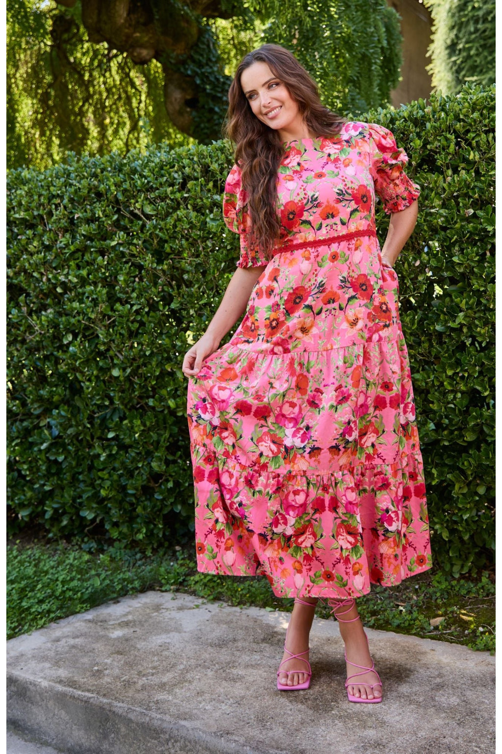 Woman wearing Hope & Ivy The Amara Puff Sleeve Bow Back Maxi Dress Pink & Red Floral by Hope and Ivy Shop Dotique
