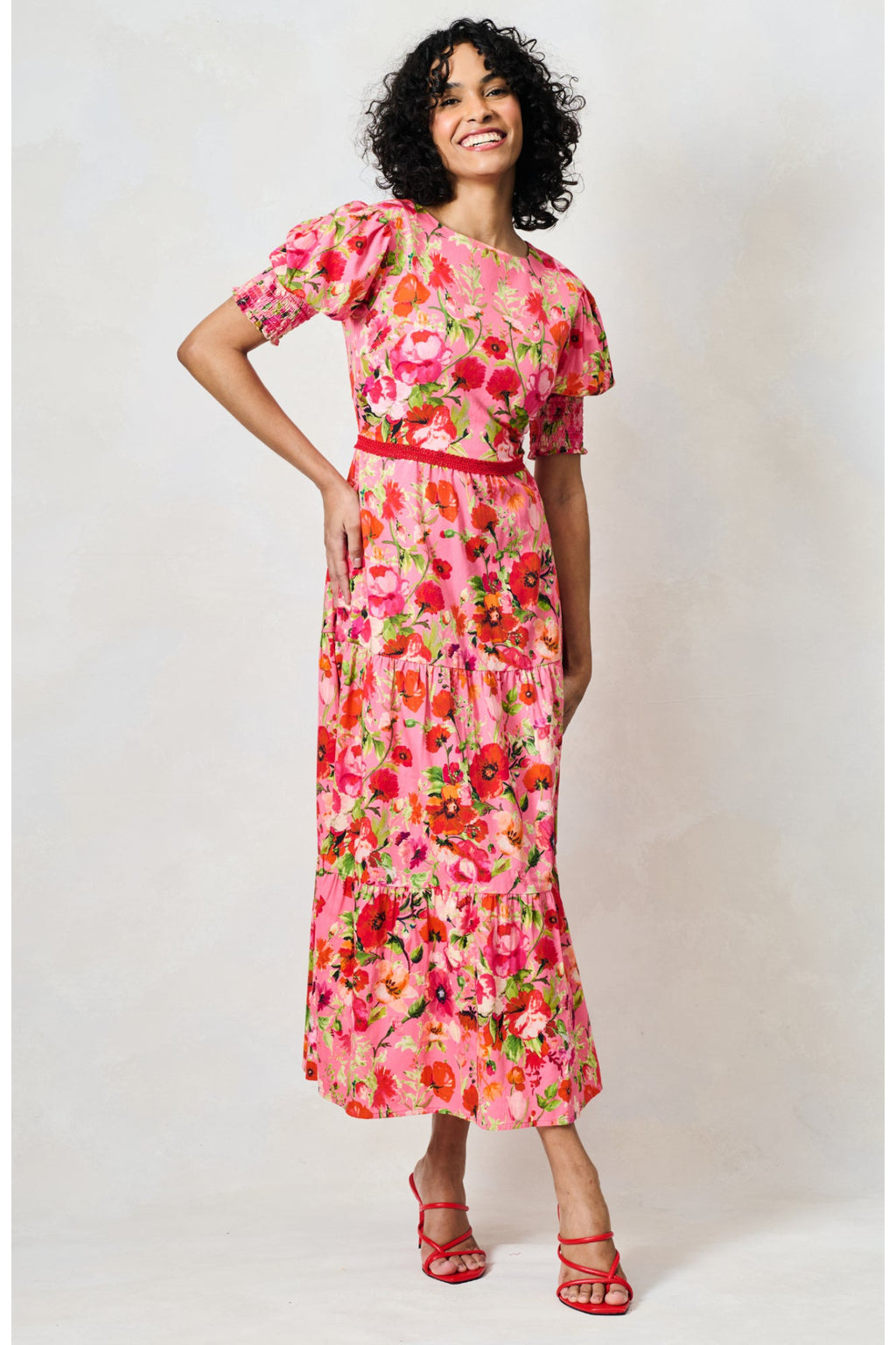 Woman wearing Hope & Ivy The Amara Puff Sleeve Bow Back Maxi Dress Pink & Red Floral by Hope and Ivy shop Dotique.