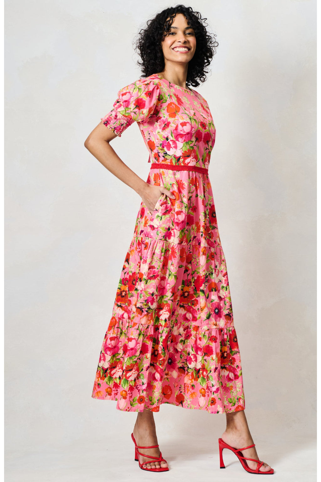 Woman wearing Hope & Ivy The Amara Puff Sleeve Bow Back Maxi Dress Pink & Red Floral by Hope and Ivy, shop at Dotique