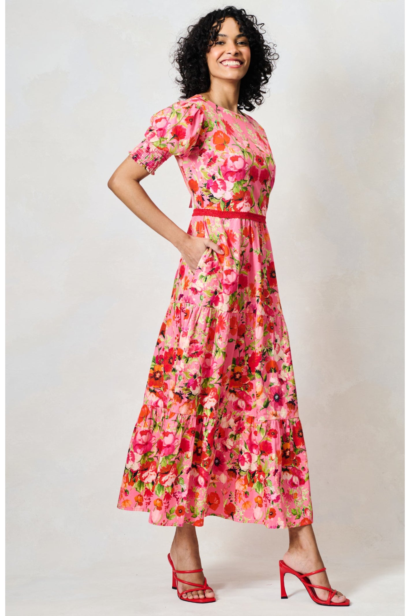 Woman wearing Hope & Ivy The Amara Puff Sleeve Bow Back Maxi Dress Pink & Red Floral by Hope and Ivy, shop at Dotique
