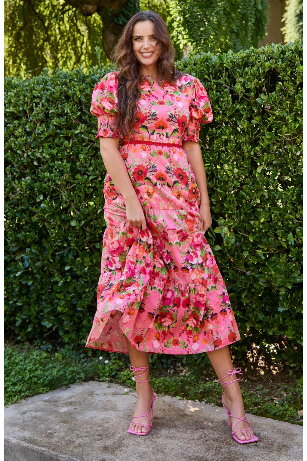 Woman wearing Hope & Ivy The Amara Puff Sleeve Bow Back Maxi Dress Pink & Red Floral by Hope and Ivy, shop at Dotique