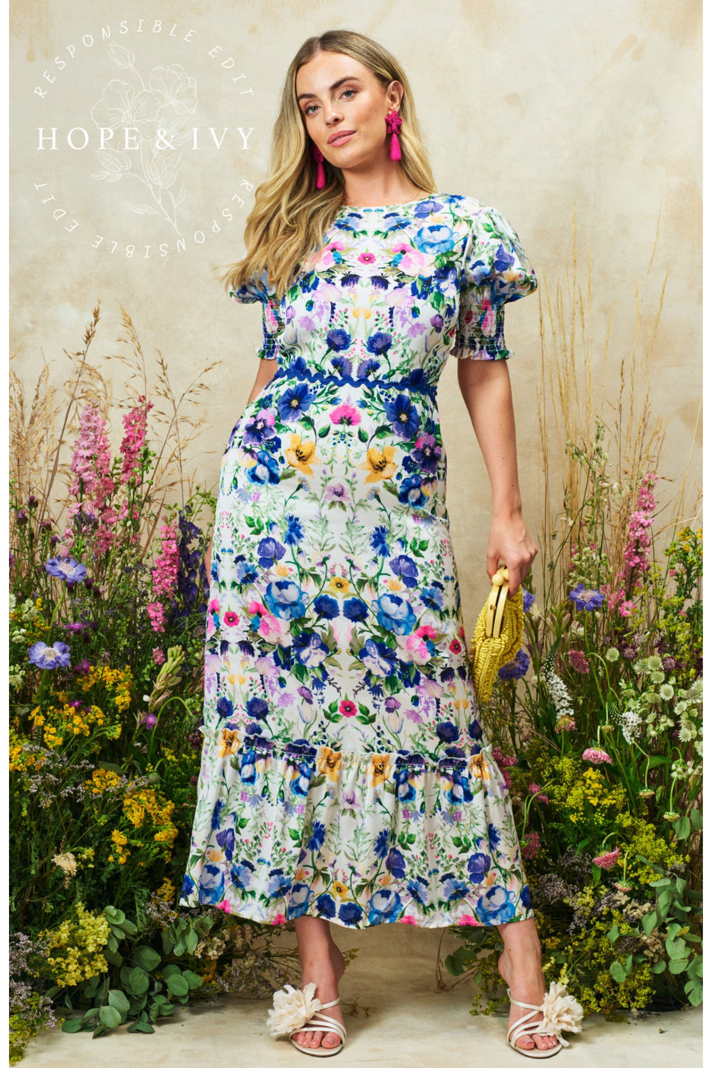 Woman wearing Hope & Ivy Charlotte Ann Puff Sleeve Maxi Dress Blue Floral by Hope and Ivy, shop Hope and Ivy at Dotique.