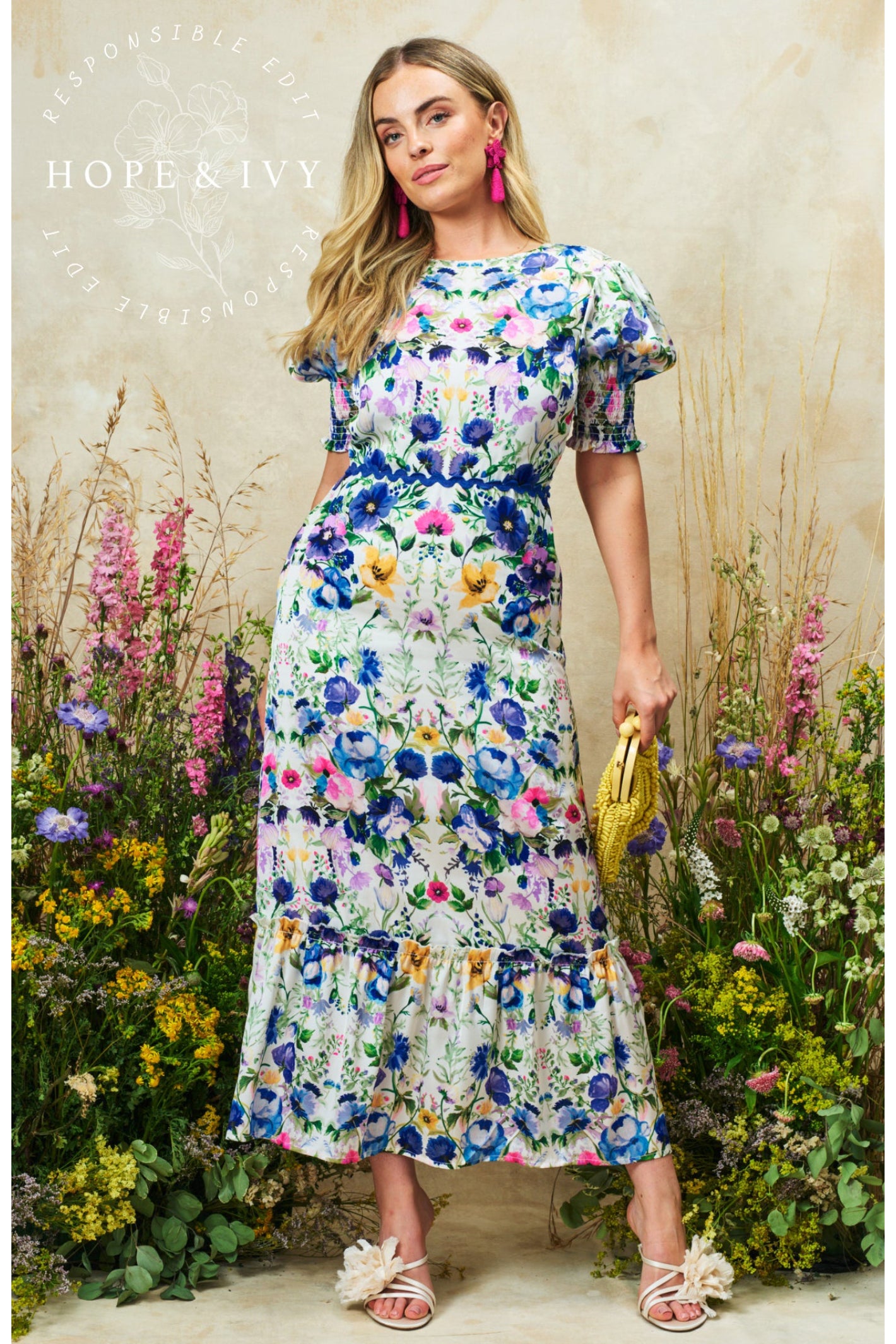 Model wearing Hope & Ivy Charlotte Ann Puff Sleeve Maxi Dress Blue Floral by Hope and Ivy, shop Dotique now.