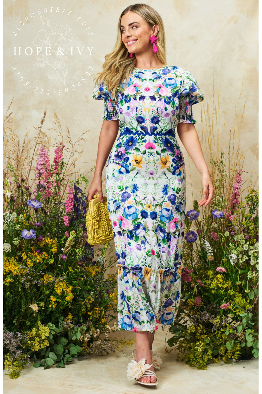 Woman wearing Hope & Ivy Charlotte Ann Puff Sleeve Maxi Dress Blue Floral, shop Hope and Ivy at Dotique.