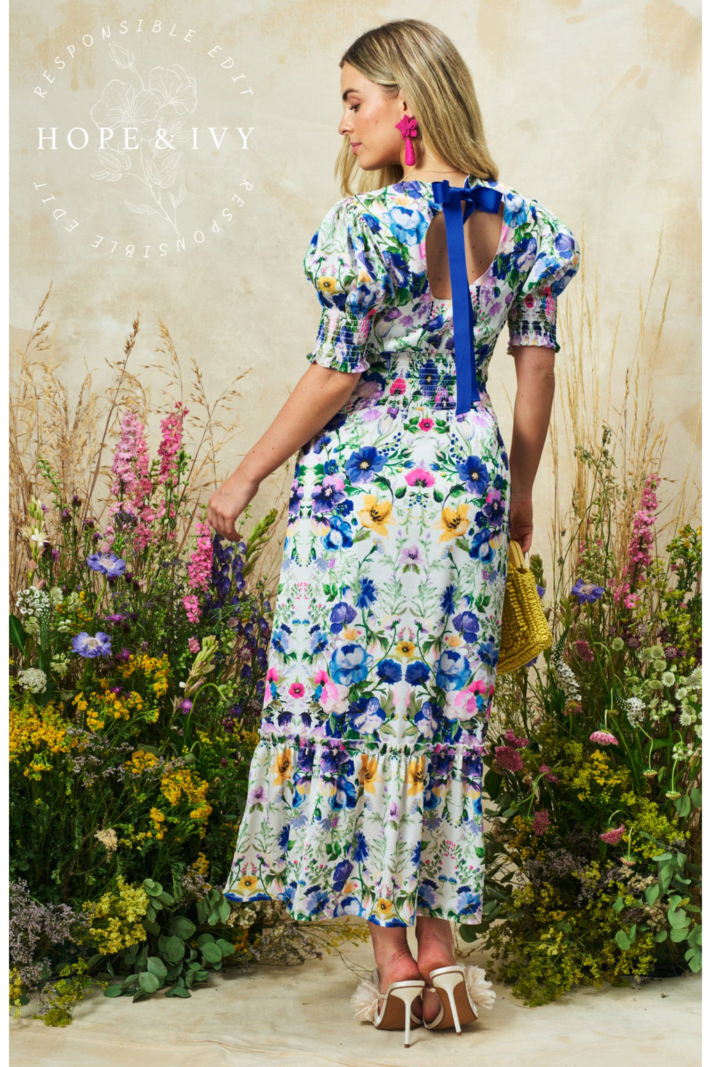 Model wearing Hope & Ivy Charlotte Ann Puff Sleeve Maxi Dress Blue Floral by Hope and Ivy, shop Hope and Ivy at Dotique.