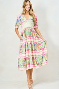 Woman wearing Hope & Ivy Larysa Maxi Dress with floral pattern by Hope and Ivy Shop Hope and Ivy at Dotique