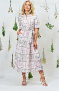 Woman wearing Hope & Ivy Pamela Tiered Maxi Dress in floral print, shop Hope and Ivy at Dotique for elegant style.