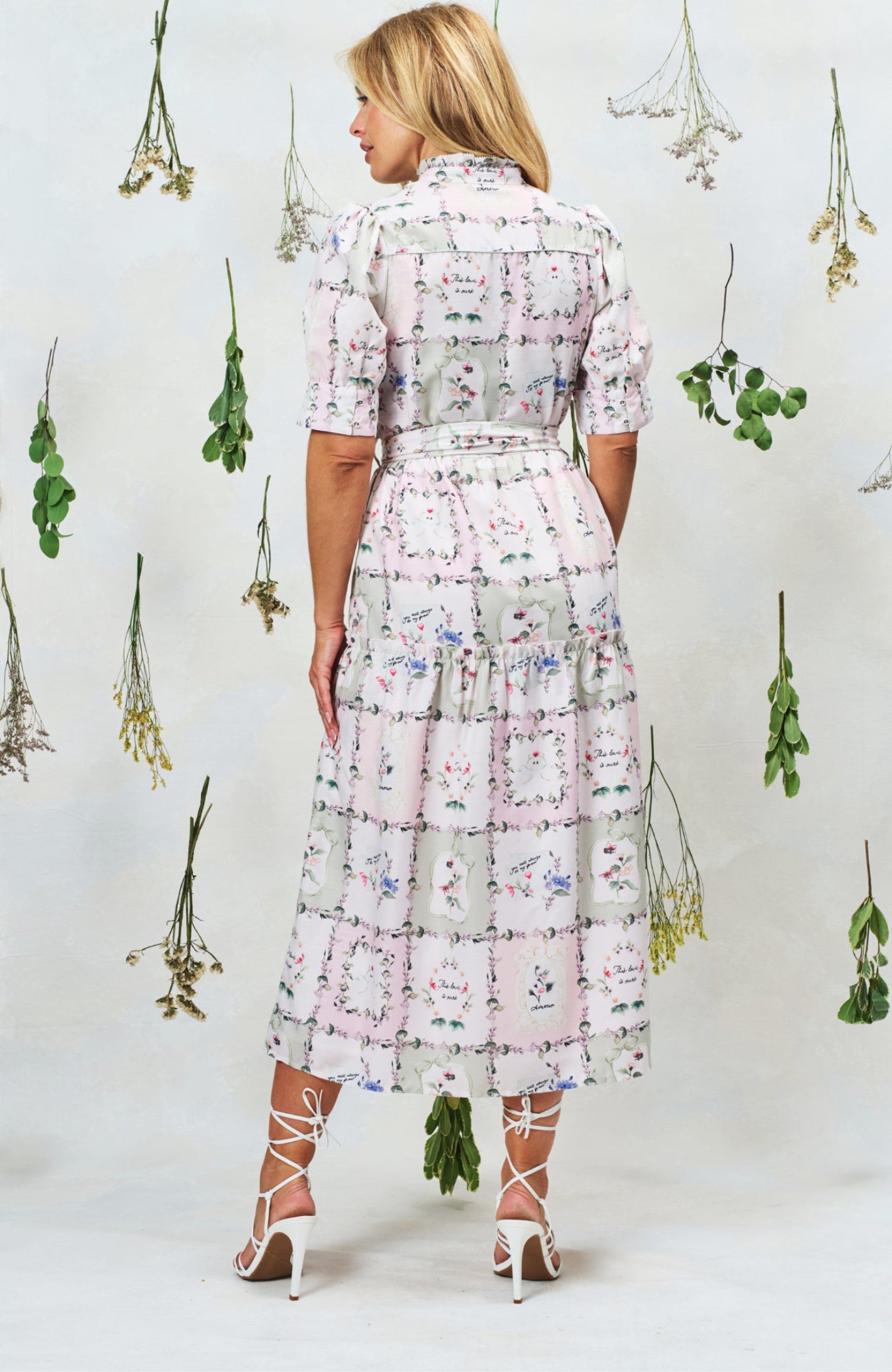 Back view of Hope & Ivy Pamela Tiered Maxi Dress in floral print, shop Hope and Ivy at Dotique for elegant style.
