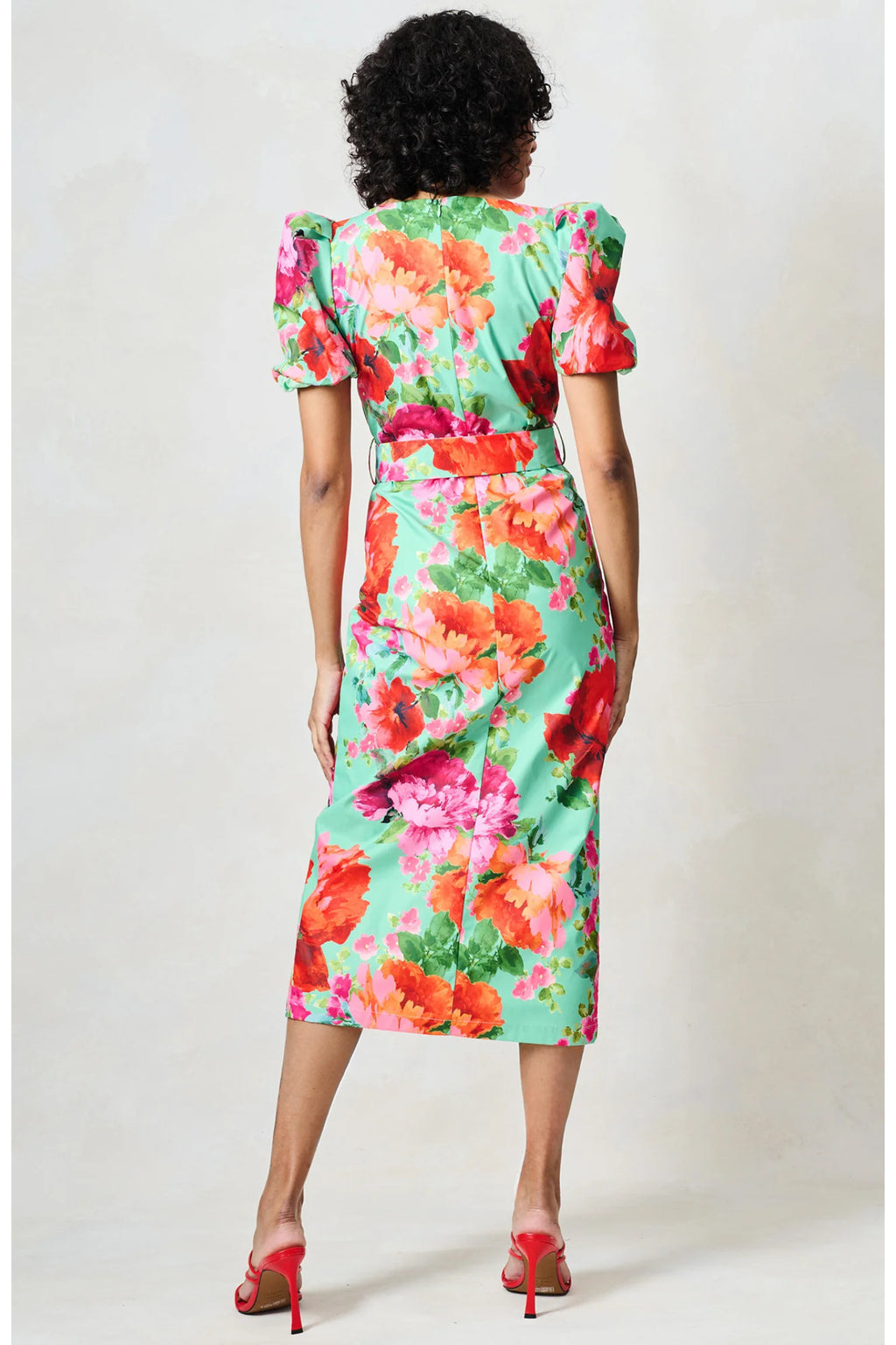 Back view of a model wearing Hope & Ivy The Rowena Puff Sleeve Sweetheart Neckline Pencil Dress by Hope and Ivy, shop at Dotique.