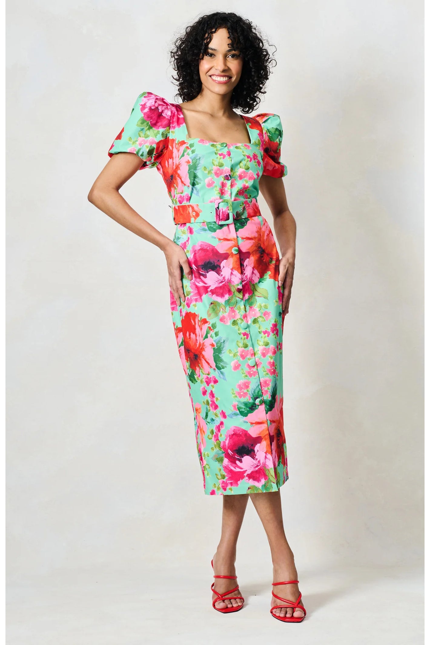 Woman wearing bright floral Hope & Ivy The Rowena Puff Sleeve Sweetheart Neckline Pencil Dress, shop Hope and Ivy at Dotique.