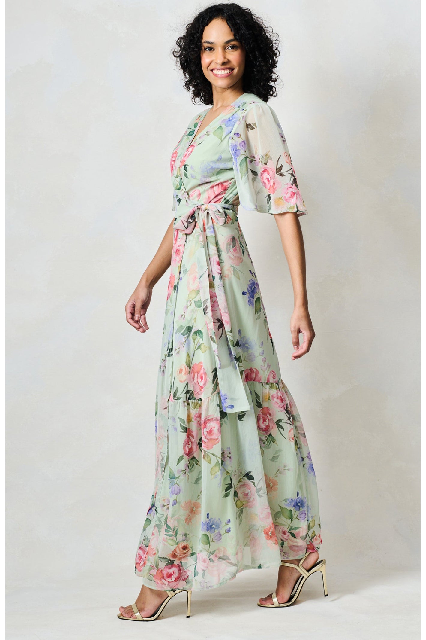 Hope & Ivy The Emi Flutter Sleeve Floral Wrap Maxi Dress Green by Hope and Ivy modeled, shop Hope and Ivy at Dotique