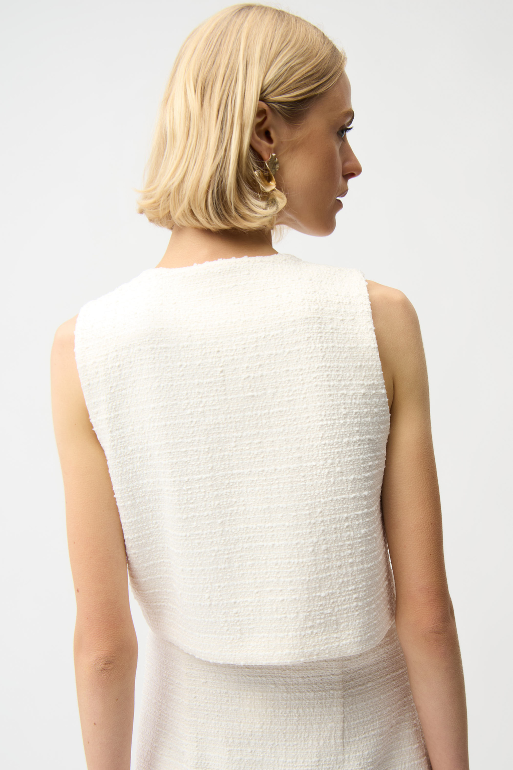 Women’s off-white bouclé vest with gold button front by Joseph Ribkoff