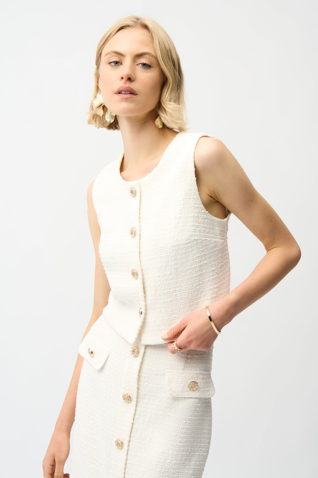 Women’s off-white bouclé vest with gold button front by Joseph Ribkoff