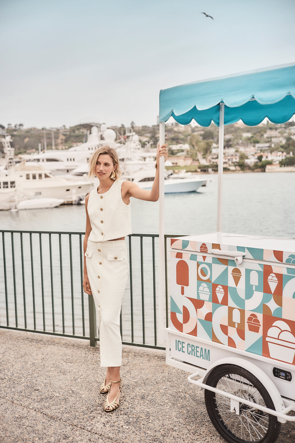 Women’s off-white bouclé vest with gold button front by Joseph Ribkoff