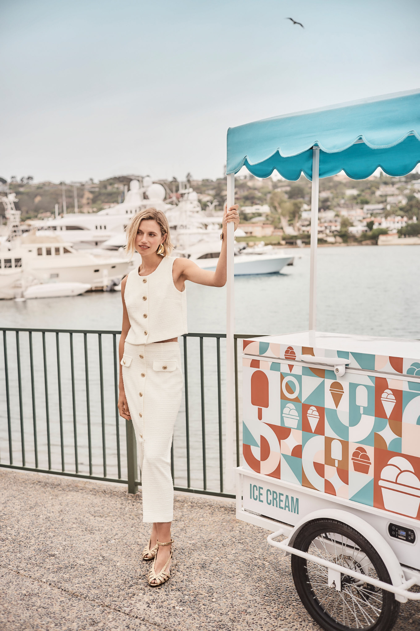 Women’s off-white bouclé vest with gold button front by Joseph Ribkoff