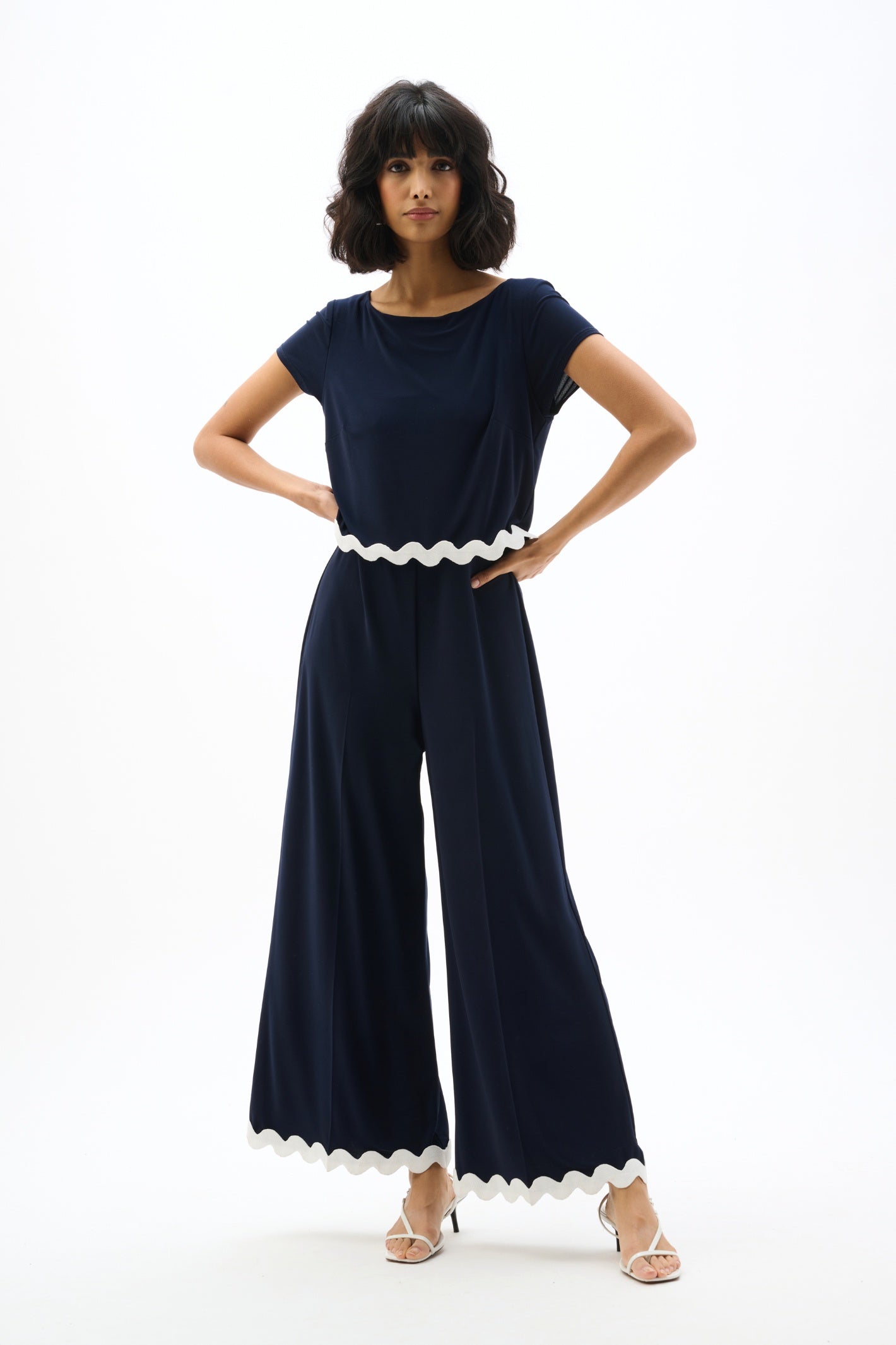Joseph Ribkoff 262144 Navy Silky Knit Culotte Jumpsuit With Contrast Trim by joseph ribkoff shop the brand at Dotique front view