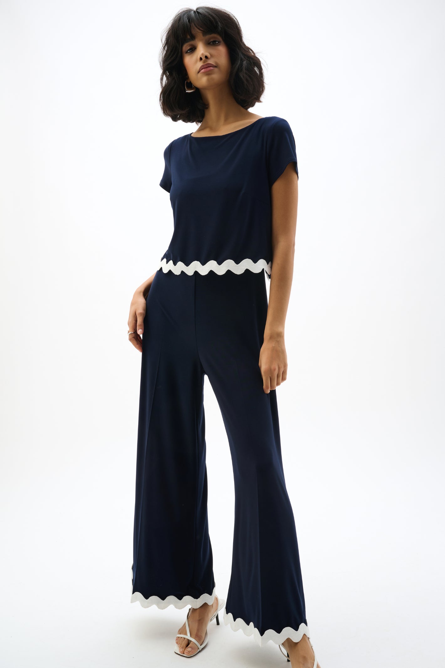 Joseph Ribkoff 262144 Navy Silky Knit Culotte Jumpsuit With Contrast Trim by joseph ribkoff shop the brand at Dotique front full body view