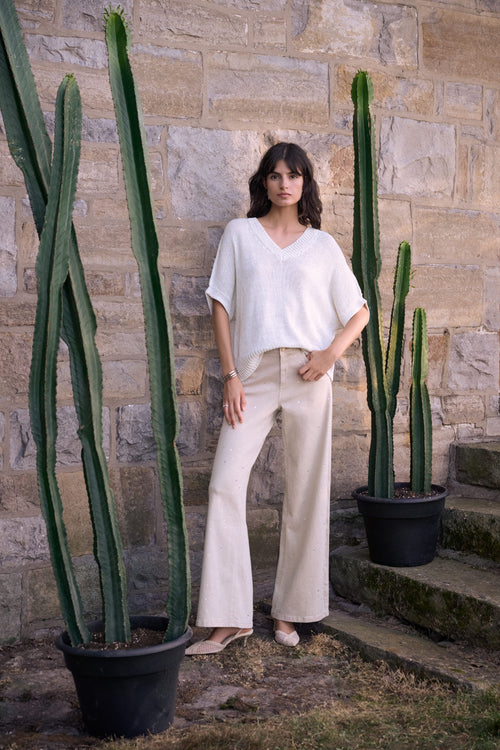 Woman wearing Joseph Ribkoff 262940 Moonstone Featherweave™ Denim Wide Leg Jeans With Rhinestones by Joseph Ribkoff shop Dotique