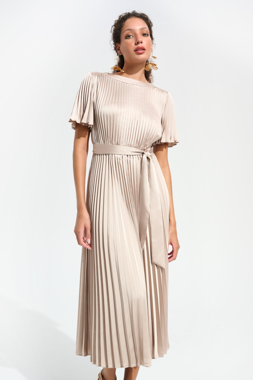 Model wearing Joseph Ribkoff 261752 Signature Pleated Satin Fit & Flare Midi Dress Champagne shop Joseph Ribkoff at Dotique