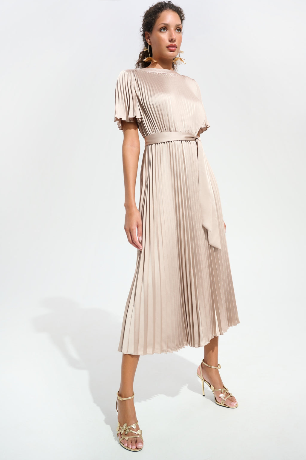 Model wearing Joseph Ribkoff 261752 Signature Pleated Satin Fit & Flare Midi Dress Champagne by Joseph Ribkoff Shop Dotique