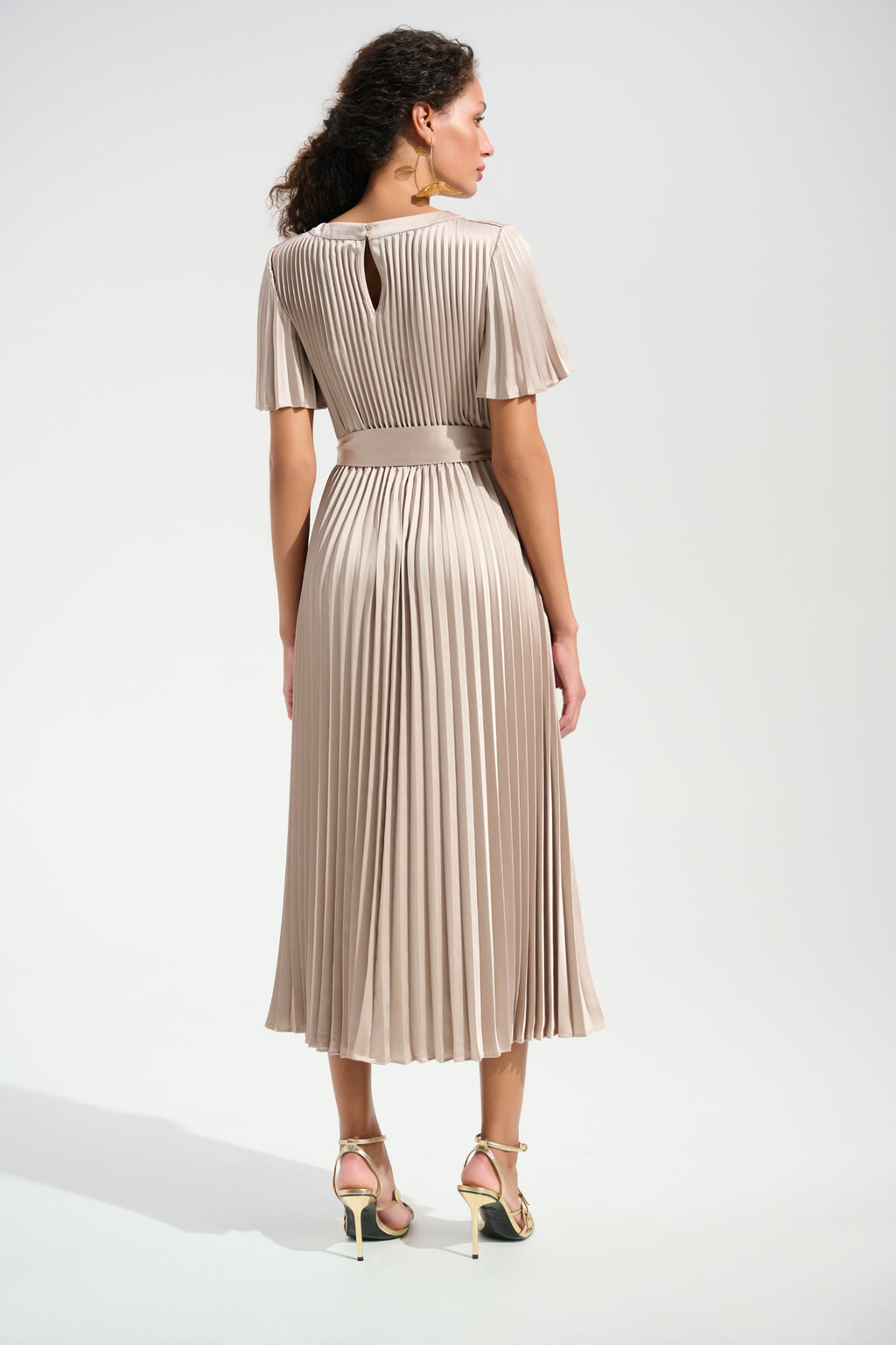Woman wearing Joseph Ribkoff 261752 Signature Pleated Satin Fit & Flare Midi Dress Champagne, shop Joseph Ribkoff at Dotique