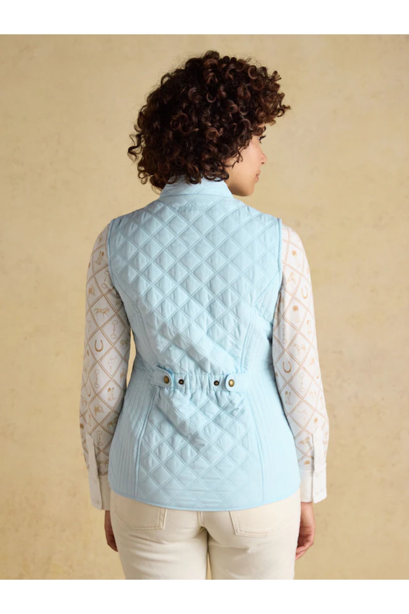 Woman wearing Joules F86654 Minx Quilted Gilet – Powder Blue from Joules, shop Joules at Dotique for stylish outerwear.
