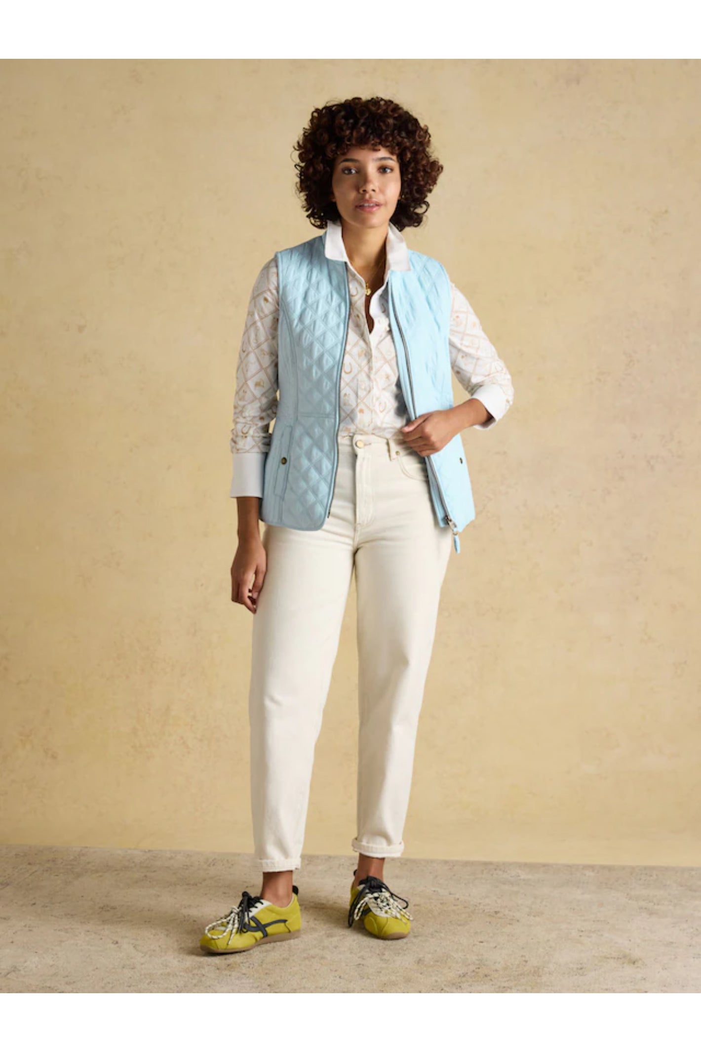Woman wearing Joules F86654 Minx Quilted Gilet – Powder Blue by Joules, shop Joules at Dotique for stylish layering.
