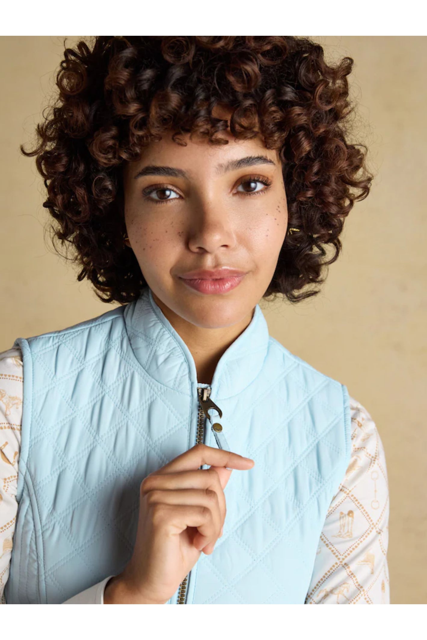 Woman wearing Joules F86654 Minx Quilted Gilet – Powder Blue by Joules, shop the Joules range at Dotique online.