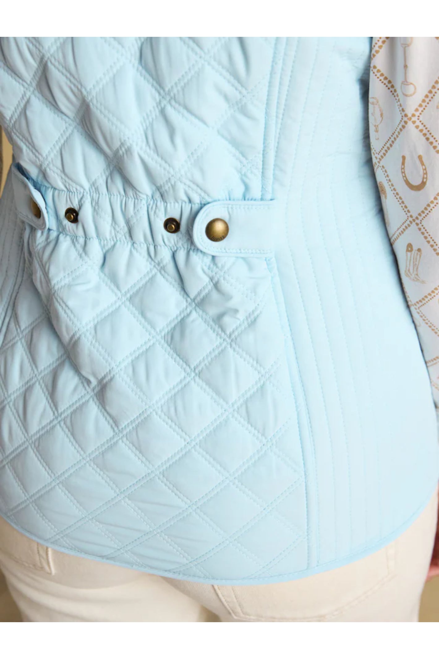 Close-up of quilted details on Joules F86654 Minx Quilted Gilet – Powder Blue from Joules, shop Joules at Dotique.