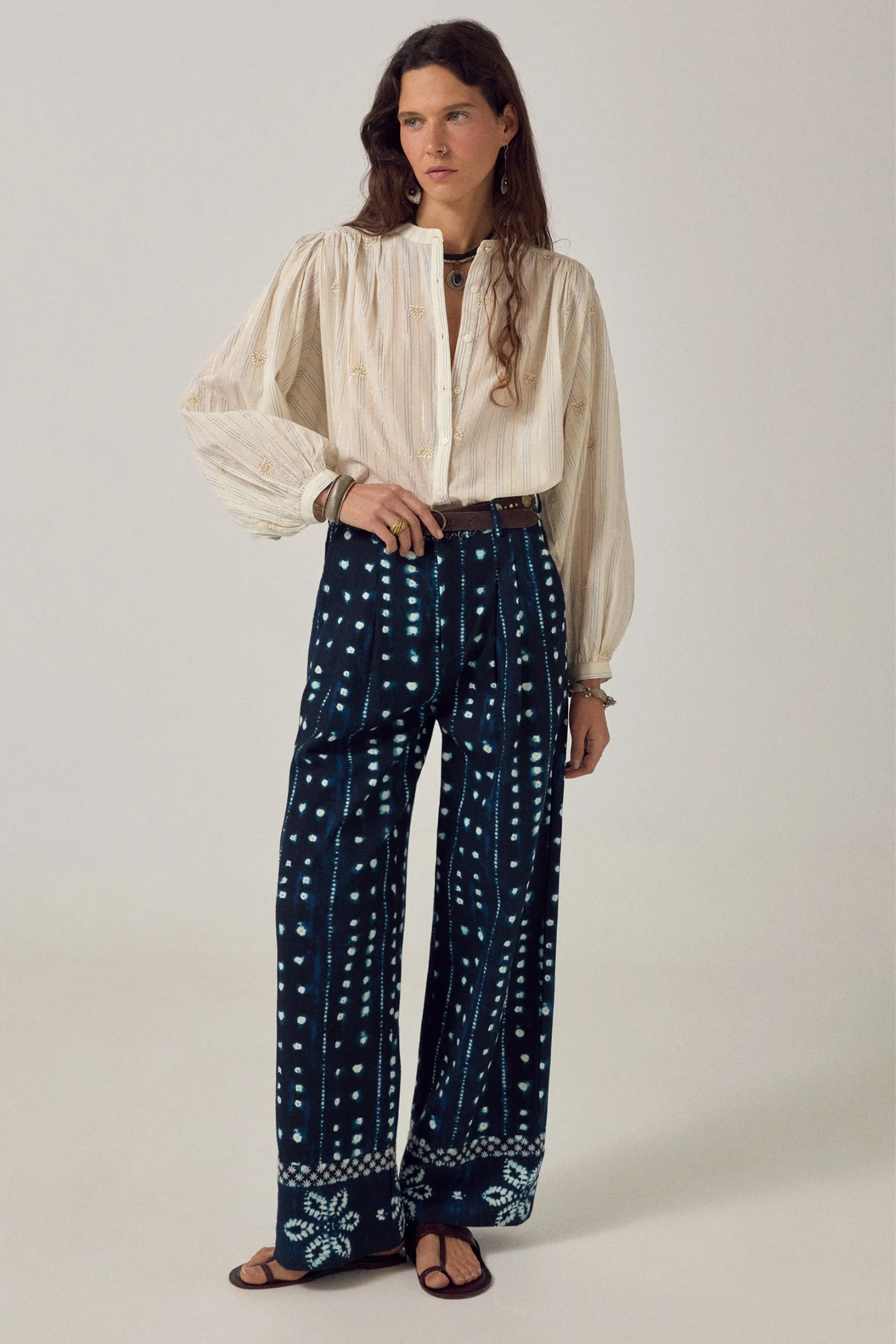 Model wearing Maison Hotel Caroline Blouse Off White paired with patterned trousers, shop Maison Hotel at Dotique for elegant blouses.