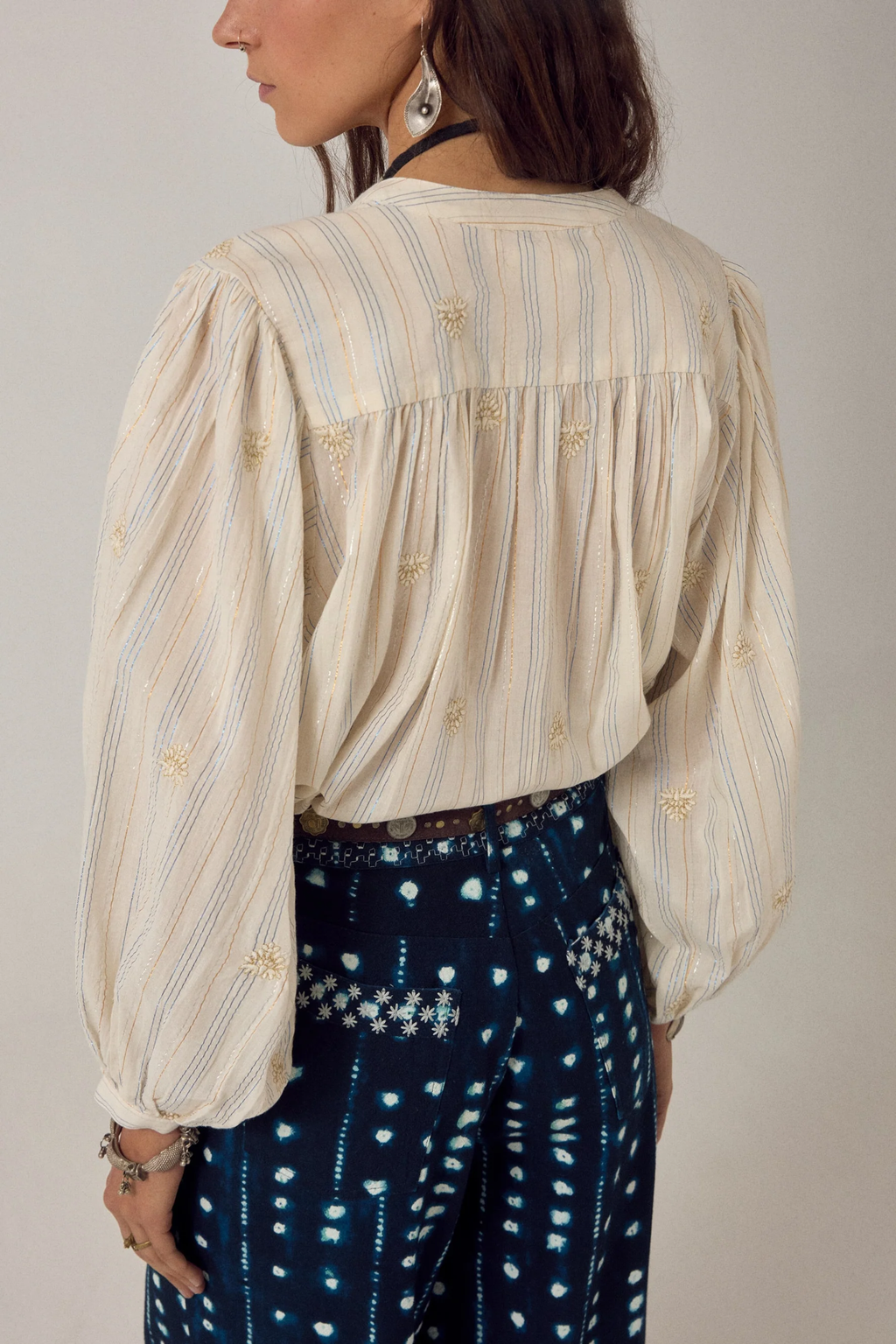 Woman wearing Maison Hotel Caroline Blouse Off White with delicate embroidery by Maison Hotel, shop Maison Hotel at Dotique for elegant tops.