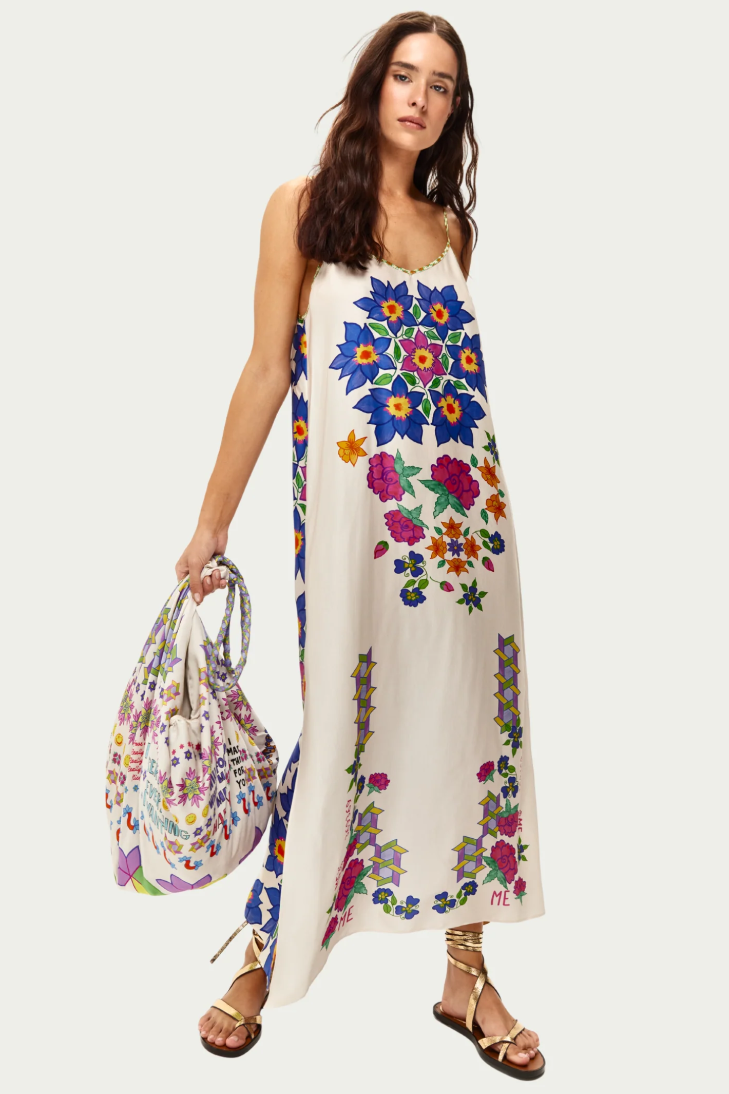 Woman wearing Me369 Olivia Camisole Markers Dress by Me369 with floral print, holding matching bag, shop Me369 at Dotique.