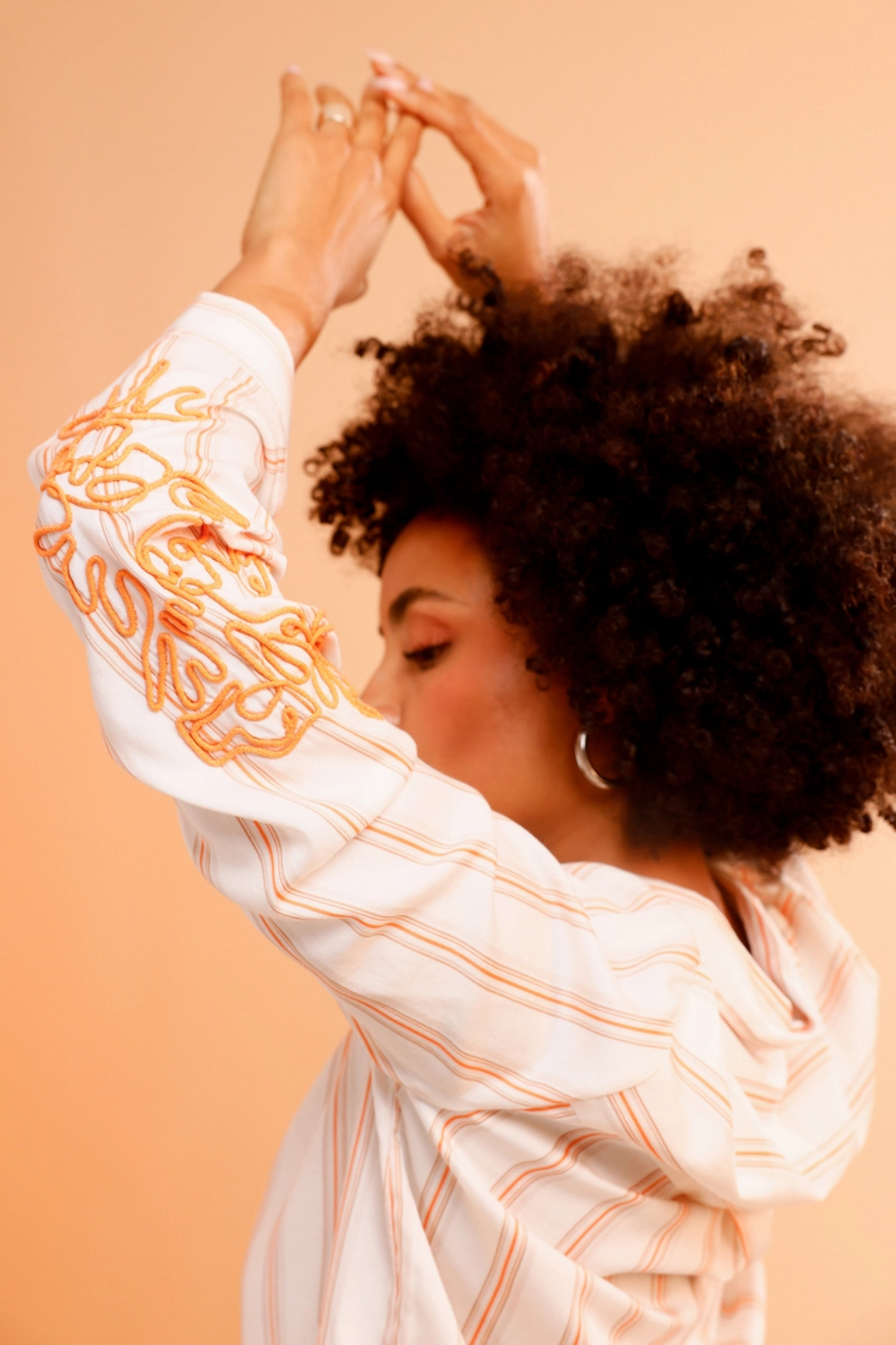 Model wears Monari 410249 Cord Embroidery Shirt Off White Pattern by Monari, shop Monari now at Dotique for stylish looks