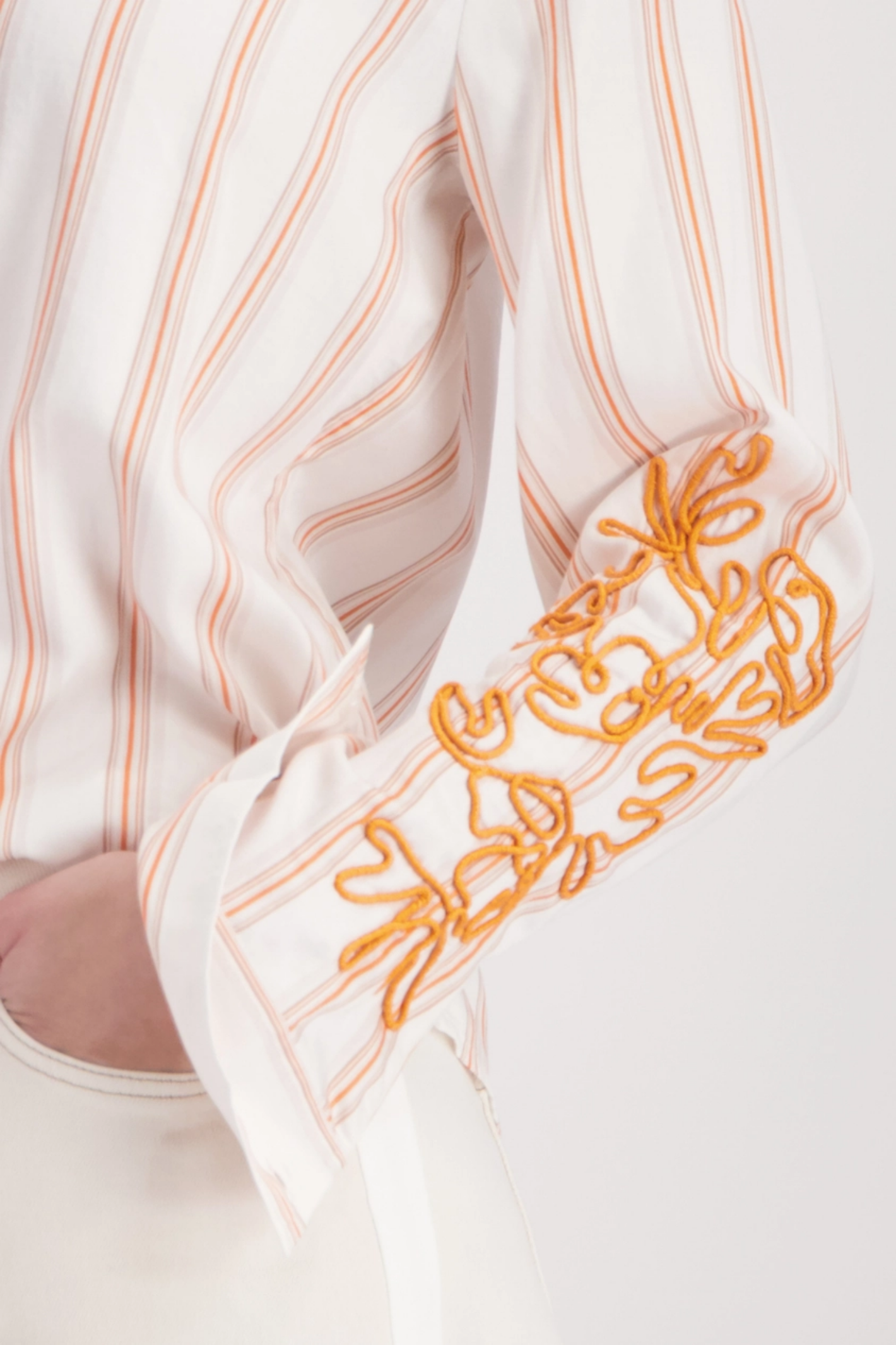 Monari 410249 Cord Embroidery Shirt Off White Pattern by Monari features detailed orange embroidery Shop Monari at Dotique